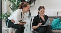Two Vaadin HR employees sitting next to each other looking at a laptop. Two Vaadin HR employees sitting next to each other looking at a laptop.